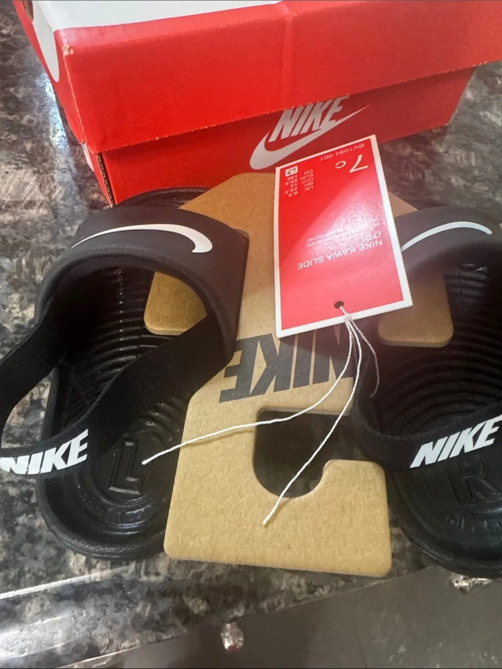Nike Black Slide Sandals with White Swoosh Accent